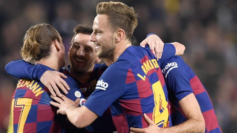 Messi hat-trick takes Barcelona back to the top